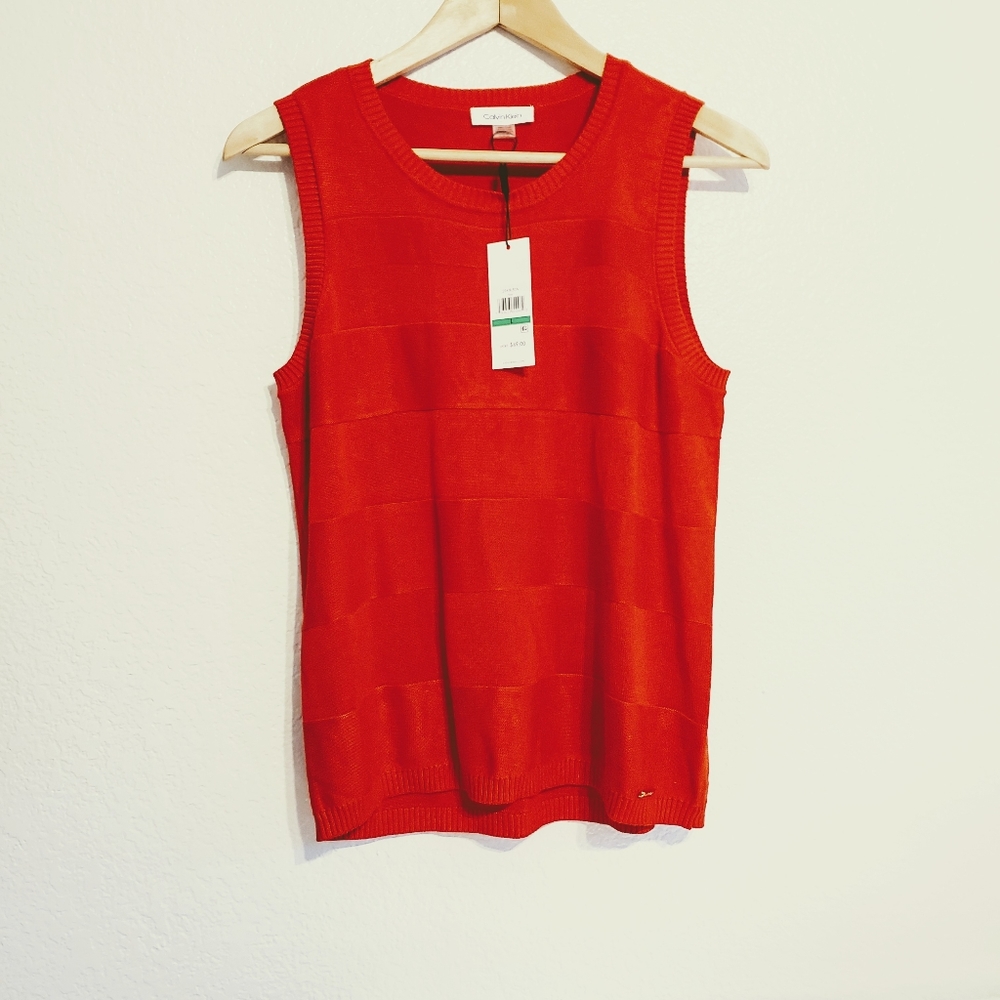 Calvin Klein red sleeveless blouse.
Size L